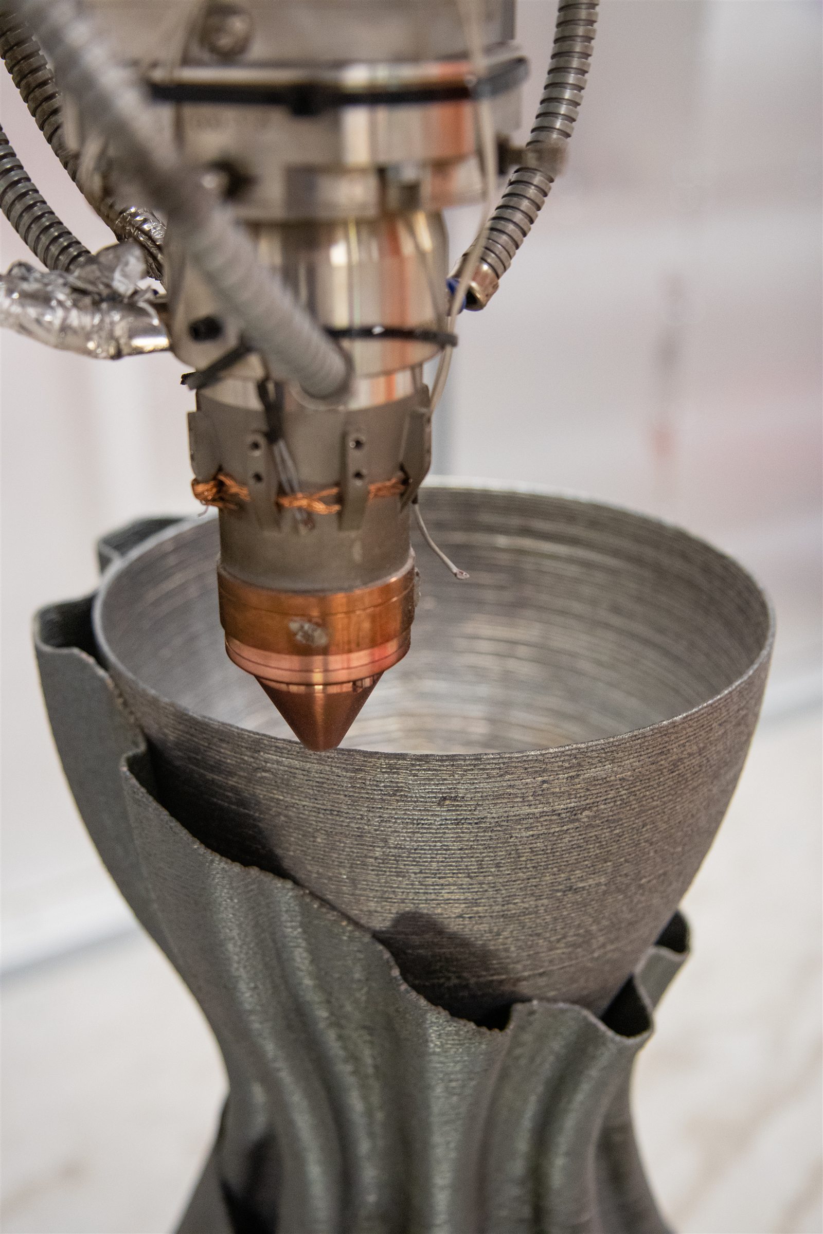 Close process view of a 750 mm multi-material LMD nozzle demonstrator