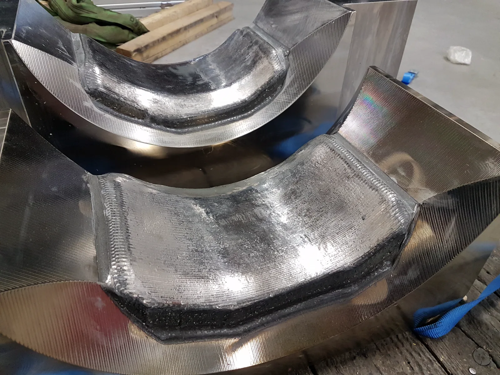 Two coated round forging dies after Inconel 625 coating and laser polishing