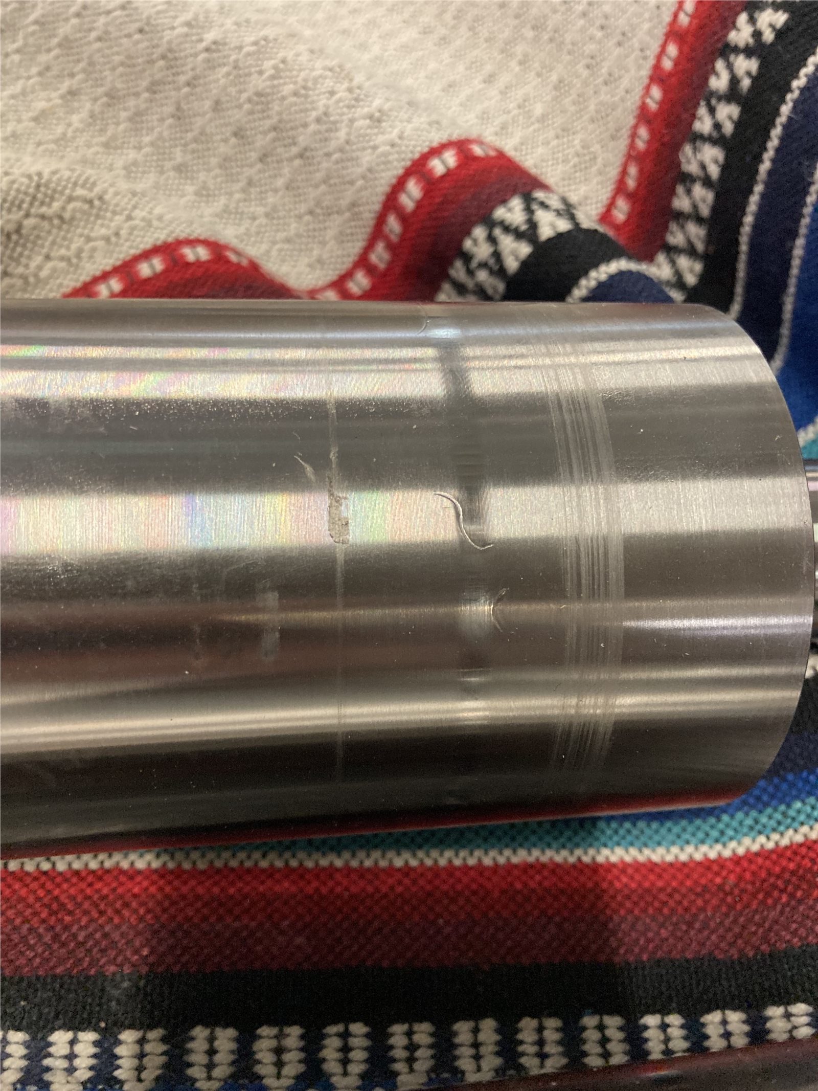 Finished cylindrical metal surface after coating and handling